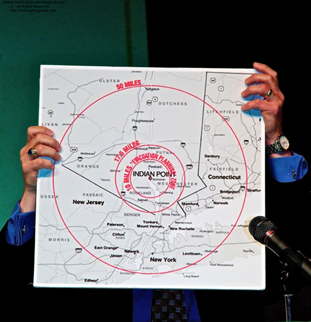 Indian Point Forum: Michael B. Kaplowitz Panelist, Westchester County Board Legislator., Holding up map showing concentric circles for 10 & 50-mile radius from Indian Point. Indian Point Forum. A Panel Discussion and Community Dialogue. Co-Sponored by Bedford 2020 Coalition and Bedford Central School District Fox lane High School, Bedford, NY. ©Mardi Welch Dickinson/Kymry Group™ All Rights Reserved.