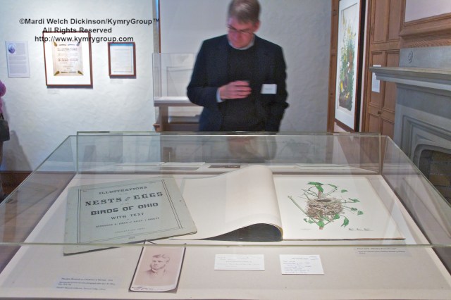 Visitor with Theodore Roosevelt’s subscription parts to Illustrations of the Nests and Eggs of Birds of Ohio, Cleveland Museum of Natural History Collection. Nests, Eggs, Heartbreak & Beauty exhibition, opening reception and book signing, Museum of American Bird Art at Mass Audubon. ©Mardi Welch Dickinson/Kymry GroupAll Rights Reserved.