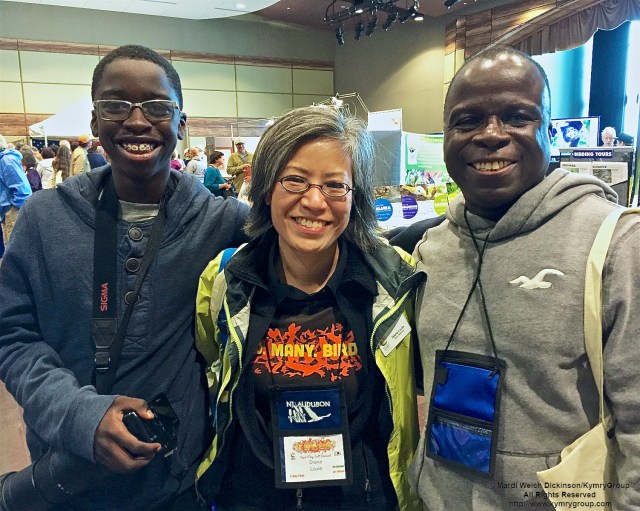 L. to R. Kojo Baidoo, Young Birder; Diane Louie, NJ Audubon Board Member; Kwamena Baidoo. Enjoying Cape May Fall Festival & Trade Show, Convention Hall, Cape May NJ. ©Mardi Welch Dickinson All Rights Reserved.